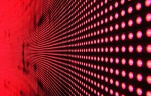 Vibrant abstract pattern of illuminated red LED lights forming a dynamic design.